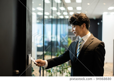 A man entering a high security office 94988680