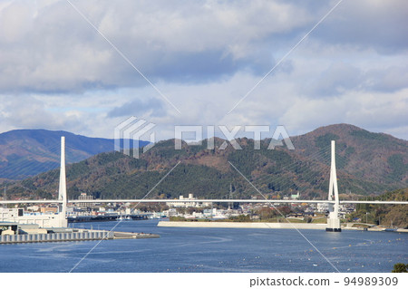 Scenery with an elevated road in the coastal area Scenery with an elevated road in the coastal area 94989309