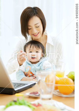 mother feeding baby mother feeding baby 94989808