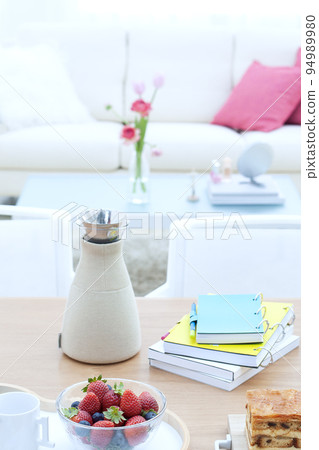 A table with a teapot and strawberries A table with a teapot and strawberries 94989980