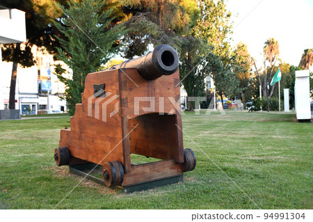 Old war cannon from a ship now resting in a garden Old war cannon from a ship now resting in a garden 94991304
