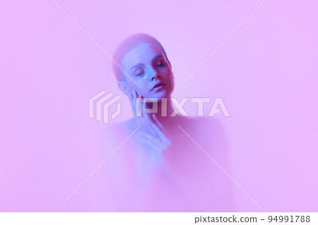 Tenderness. Silhouette of young girl immersed in clouds of smoke, fog on pink neon background with backlight diffuser. Art, creativity, futurism 94991788
