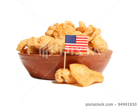 Pile of Fried Pork Skins on White background With Flag of United States Pile of Fried Pork Skins on White background With Flag of United States 94991830