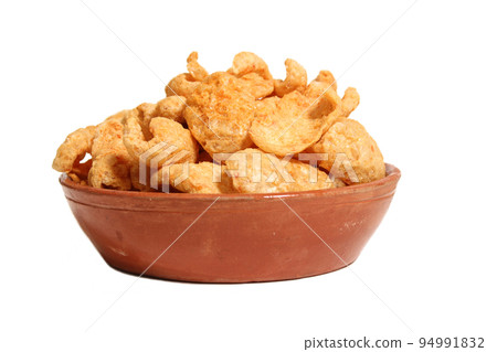 Bowl of Fried Pork Skins Isolated on White Background Bowl of Fried Pork Skins Isolated on White Background 94991832