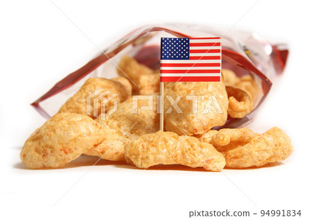 Open Bag of Fried Pork Skins With Flag of United States 94991834