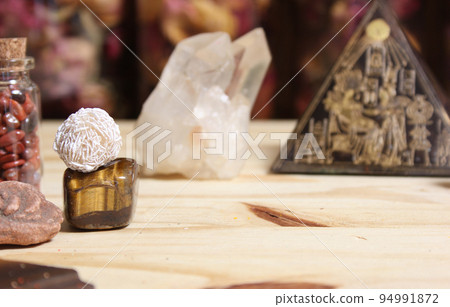 Desert Rose Stones and Crystals With Pyramid on Meditation Table Desert Rose Stones and Crystals With Pyramid on Meditation Table 94991872