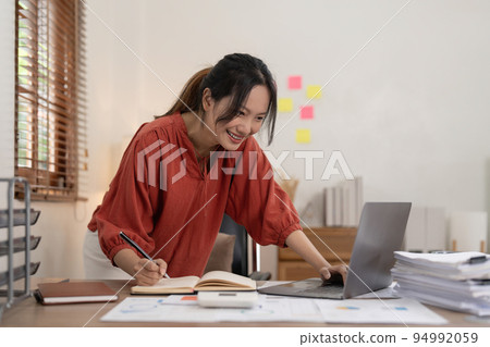 Asian woman working with laptop at home. work from home concept Asian woman working with laptop at home. work from home concept 94992059