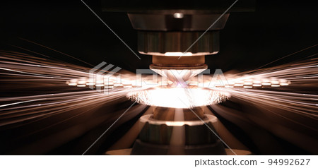 Laser cutting of metal sheet in production closeup Laser cutting of metal sheet in production closeup 94992627