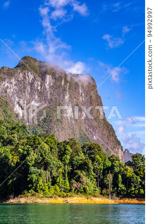View of Khao Sok national park Cheow Lan Dam lake in Surat Thani, Thailand View of Khao Sok national park Cheow Lan Dam lake in Surat Thani, Thailand 94992997