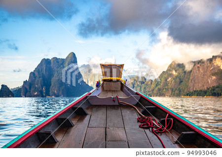 Long Tail boat on Khao Sok national park Cheow Lan Dam lake in Surat Thani, Thailand Long Tail boat on Khao Sok national park Cheow Lan Dam lake in Surat Thani, Thailand 94993046