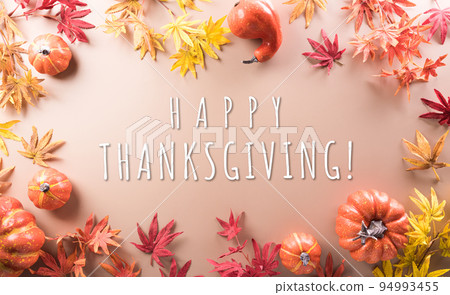 Thanksgiving and Autumn decoration made from autumn leaves, pumpkin and the text on pastel background. Thanksgiving and Autumn decoration made from autumn leaves, pumpkin and the text on pastel background. 94993455
