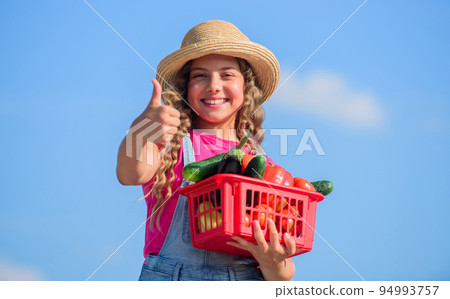 Food alternative. kid summer farm. Organic food. little girl vegetable in basket. Only natural. healthy food for children. happy little farmer. autumn harvest. harvest vitamin. spring market garden Food alternative. kid summer farm. Organic food. little girl vegetable in basket. Only natural. healthy food for children. happy little farmer. autumn harvest. harvest vitamin. spring market garden 94993757