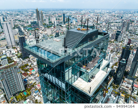 Aerial view of King Power Mahanakhon tower in Sathorn Silom central business district of Bangkok Aerial view of King Power Mahanakhon tower in Sathorn Silom central business district of Bangkok 94994164