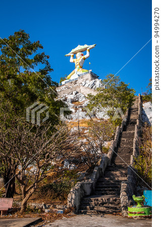 Aerial view of Wat Khao Samo Khon temple, with hanuman monkey god statue on top of mountain, in 94994270