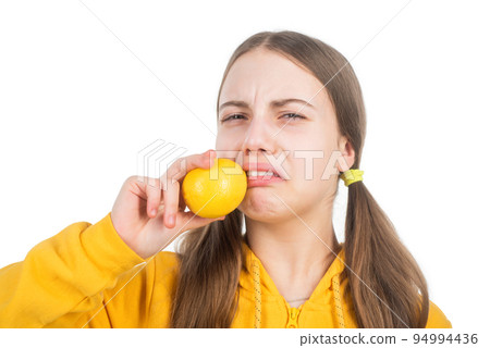 kid with sour citrus lemon fruit full of vitamins isolated on white, nutrients 94994436