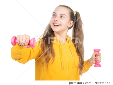 so funny. determination. happy teen girl with dumbbell. sport and fitness. 94994437