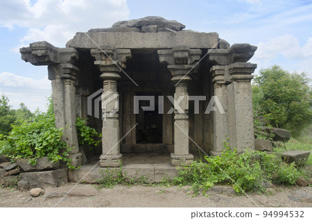 Ruins of a small rock temple at Bahadurgad - also known as Dharmaveergad, located on the left bank of river Bhima, Pedgaon, Taluka Shrigonda, Maharashtra, India 94994532