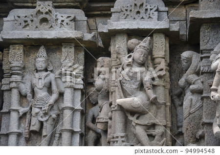 Sculptures carved on the outer wall of the Laxminarayana temple one of the five rock temples inside Bahadurgad, Pedgaon, Taluka Shrigonda, Maharashtra, India 94994548