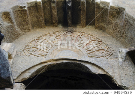 Bhutalinga cave with a horseshoe arch over the entrance containing petal-shaped compartments filled with reliefs of Lakshmi, elephants and devotees, rock-cut caves, Manmodi Hill at Junnar, near Pune, Bhutalinga cave with a horseshoe arch over the entrance containing petal-shaped compartments filled with reliefs of Lakshmi, elephants and devotees, rock-cut caves, Manmodi Hill at Junnar, near Pune, 94994589
