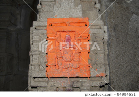 Carved idol of Lord Ganapati on the inner wall of Kukdeshwar Temple, dedicated to Lord Shiva, it lies on the banks of Kukdi river, located at Junnar, near Pune, Maharashtra, India 94994651