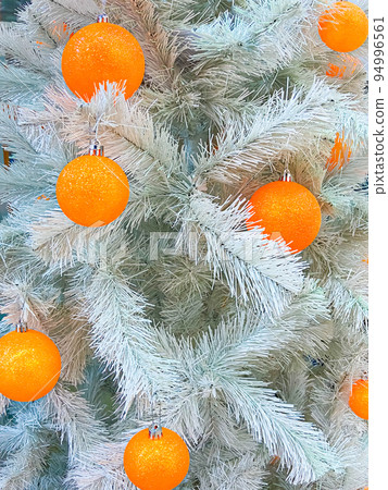 Non traditional colors of Christmass tree decoratons 94996561