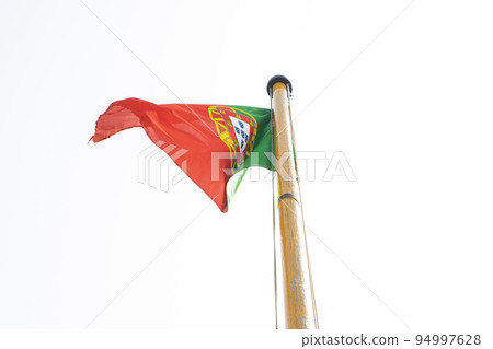 Waving National flag of Portugal in the wind on ship's mast 94997628