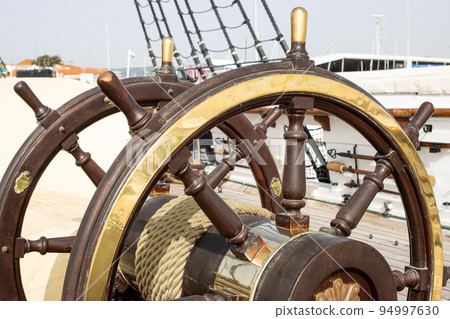 Double ship's steering wheel on the old retro battleship 94997630