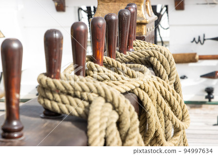 Ship's tackle on the deck of battle ship - ropes - military historical vessel Ship's tackle on the deck of battle ship - ropes - military historical vessel 94997634