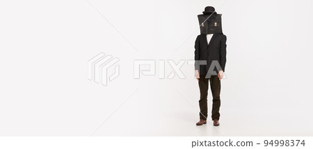 Portrait of stylish man in brown suit covering face with briefcase isolated over white studio background Portrait of stylish man in brown suit covering face with briefcase isolated over white studio background 94998374