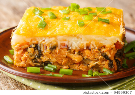 Brazilian Shepherds Pie Escondidinho made of mashed potatoes and ground meat with vegetables closeup in the plate. Horizontal Brazilian Shepherds Pie Escondidinho made of mashed potatoes and ground meat with vegetables closeup in the plate. Horizontal 94999307