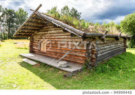 Ancient wooden residential house in Russia. X century settlement, typical houses reconstruction 94999448