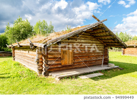 Ancient wooden residential house in Russia. X century settlement, typical houses reconstruction 94999449