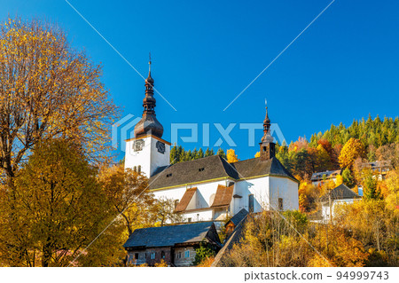 Church in The Spania Dolina village at autumn season, Slovakia. 94999743