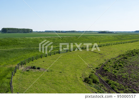View over the agriculture fields and nature reserve of the drowned land of Saeftinghe nature reserve View over the agriculture fields and nature reserve of the drowned land of Saeftinghe nature reserve 95000557