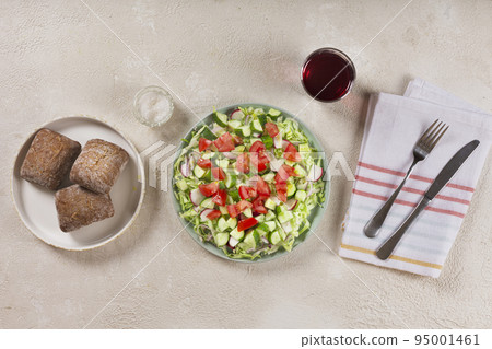 Full bowl of fresh green salad top view Full bowl of fresh green salad top view 95001461