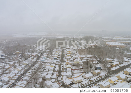 In Sayreville, New Jersey, a small town in the state of New Jersey, a home complex covered in bright white snow during the winter months. In Sayreville, New Jersey, a small town in the state of New Jersey, a home complex covered in bright white snow during the winter months. 95001706