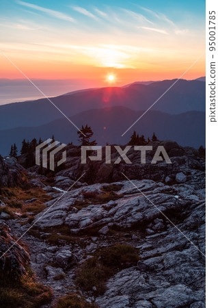 Rocky top of Canadian Mountain Landscape. Sunny Sunset Sky. 95001785