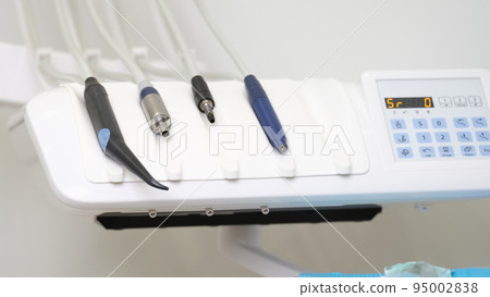 Medical equipment and dentistry closeup. Dental instruments for dental treatment Medical equipment and dentistry closeup. Dental instruments for dental treatment 95002838
