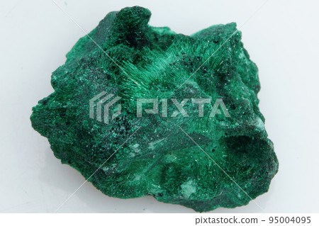 Natural gemstone green malachite on white background 95004095
