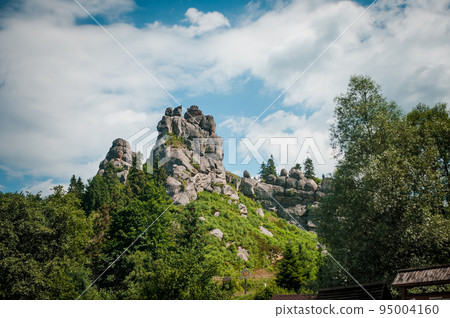 Remains of the rocks of the city of Tustan fortress in the Carpathian mountains Remains of the rocks of the city of Tustan fortress in the Carpathian mountains 95004160