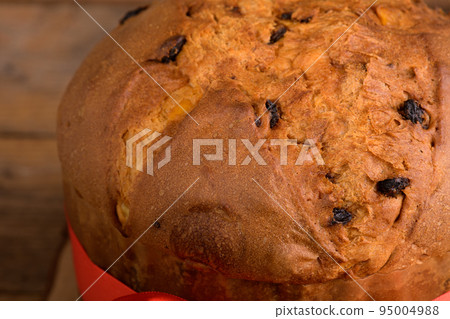 Traditional Italian Christmas Cake Panettone with on wooden rustic background, close up 95004988