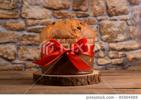 Traditional Italian Christmas Cake Panettone on wooden rustic background 95004989