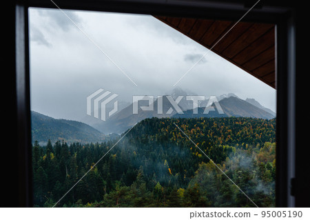 View from the window to the mountains and forest View from the window to the mountains and forest 95005190