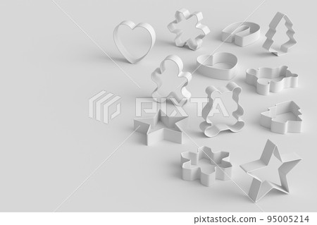 Set of metal cookie cutters for homemade Christmas biscuit on monochrome 95005214