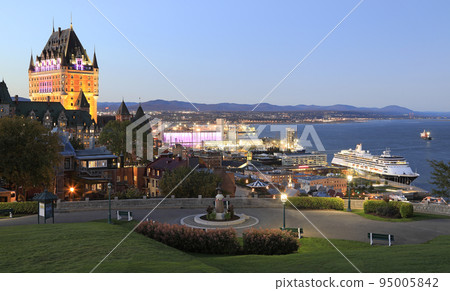 Quebec City and St. Lawrence River with a cruise ship at dusk, Canada 95005842