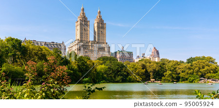Skyline panorama with Eldorado building and reservoir with boats in Central Park in midtown Manhattan in New York City 95005924