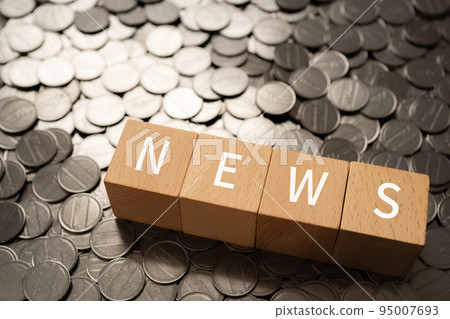 Blocks and coins written NEWS 95007693