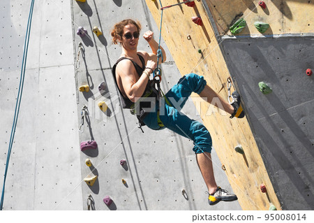 man climbing up the wall man climbing up the wall 95008014