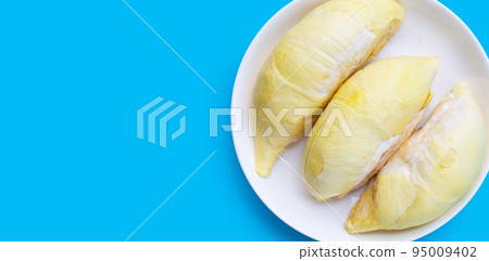 Fresh ripe cut durian on blue background. Fresh ripe cut durian on blue background. 95009402