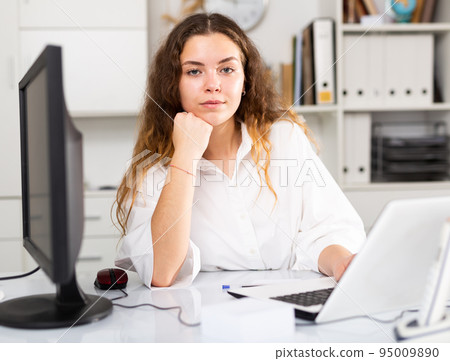 Portrait of young female office worker 95009890